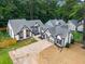 A front exterior view showcasing a home with unique windows and contrasting trim at 3100 Mount Gilead Sw Rd, Atlanta, GA 30311
