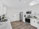 Well-lit kitchen features stainless steel appliances and white cabinets at 3100 Mount Gilead Sw Rd, Atlanta, GA 30311