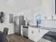 Updated kitchen with stainless steel appliances, white cabinets and countertops at 3100 Mount Gilead Sw Rd, Atlanta, GA 30311