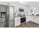 Modern kitchen with stainless steel appliances and white cabinets at 3100 Mount Gilead Sw Rd, Atlanta, GA 30311