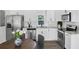 Modern kitchen featuring stainless steel appliances, white subway tile backsplash, and light granite countertops at 3100 Mount Gilead Sw Rd, Atlanta, GA 30311