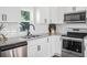 Well-lit kitchen with stainless steel appliances, granite countertops, and subway tile backsplash at 3100 Mount Gilead Sw Rd, Atlanta, GA 30311