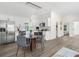 Eat-in kitchen featuring white cabinets, stainless steel appliances, and hardwood floors at 3100 Mount Gilead Sw Rd, Atlanta, GA 30311