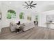 Bright living room boasts large windows, fireplace, ceiling fan and hardwood floors at 3100 Mount Gilead Sw Rd, Atlanta, GA 30311