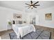 Spacious main bedroom with ceiling fan, stylish decor, and ensuite bathroom at 3100 Mount Gilead Sw Rd, Atlanta, GA 30311
