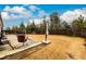 This backyard is expansive and includes hanging chairs at 3430 Summerpoint Xing, Cumming, GA 30028