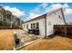 A spacious backyard featuring a patio area ideal for outdoor grilling and entertaining at 3430 Summerpoint Xing, Cumming, GA 30028