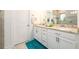 This bathroom features granite countertops, double sinks, and white cabinets, offering a clean and elegant space at 3430 Summerpoint Xing, Cumming, GA 30028