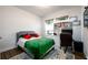 Cozy bedroom features a study desk, natural light, and hardwood floors, creating a peaceful and productive space at 3430 Summerpoint Xing, Cumming, GA 30028