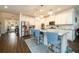 Modern kitchen with granite countertops, stainless steel appliances, and stylish seating at the island at 3430 Summerpoint Xing, Cumming, GA 30028