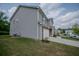 Exterior view of the home with lush green grass and manicured yard at 6827 Chataran Dr, Lithia Springs, GA 30122