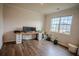Bright and airy office space featuring hardwood floors, ample natural light, and modern desk setup at 6827 Chataran Dr, Lithia Springs, GA 30122