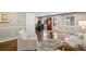 Bright living room featuring hardwood floors, modern furniture, and a view into the dining area at 1684 Braeburn Se Dr, Atlanta, GA 30316