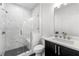 Modern bathroom featuring a glass-enclosed shower with marble tiling and a sleek vanity at 343 Concord St, Alpharetta, GA 30009