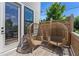 Relaxing outdoor deck with two modern wicker chairs and wood paneling at 343 Concord St, Alpharetta, GA 30009
