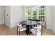 Bright dining area features modern furnishings, light wood flooring, and large windows offering natural light at 343 Concord St, Alpharetta, GA 30009