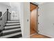 A staircase landing features an elevator for easy access between floors at 343 Concord St, Alpharetta, GA 30009