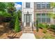 Charming brick and siding front exterior of a house, with a landscaped yard and stone stairs at 343 Concord St, Alpharetta, GA 30009