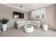 Stylish covered patio with comfortable seating, a modern fire pit, and a mounted flatscreen TV at 343 Concord St, Alpharetta, GA 30009