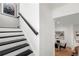 Modern staircase leads to a dining room and living area at 343 Concord St, Alpharetta, GA 30009