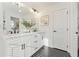 Modern bathroom with double vanity, sleek fixtures, black hexagon tile floor and modern finishes at 436 Carrera Ln, Acworth, GA 30102