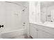 Bright bathroom featuring a shower-tub combo, modern vanity, and neutral color palette at 803 Courtenay Ne Dr, Atlanta, GA 30306