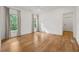 This bedroom is bright, spacious, and features hardwood floors and large windows with natural light at 803 Courtenay Ne Dr, Atlanta, GA 30306