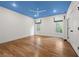 This bedroom boasts hardwood floors, lots of natural light, and a custom-colored blue ceiling at 803 Courtenay Ne Dr, Atlanta, GA 30306