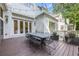 Wooden deck is perfect for outdoor living with a dining table and chairs offering a great space for gatherings at 803 Courtenay Ne Dr, Atlanta, GA 30306