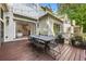 Outdoor deck with a dining table and chairs, ideal for outdoor entertaining with seamless indoor/outdoor living at 803 Courtenay Ne Dr, Atlanta, GA 30306