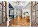 Inviting foyer with hardwood floors, white walls, and a view into a stylish seating area at 803 Courtenay Ne Dr, Atlanta, GA 30306