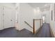 Bright hallway with hardwood floors and modern finishes, seamlessly connecting different areas of the home at 803 Courtenay Ne Dr, Atlanta, GA 30306