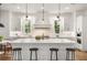 Open kitchen features a large central island, modern appliances, and ample cabinet space for storage at 803 Courtenay Ne Dr, Atlanta, GA 30306