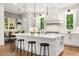 Bright kitchen boasts a large island with seating, modern appliances, and natural light from multiple windows at 803 Courtenay Ne Dr, Atlanta, GA 30306