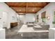 Bright living room with a wood ceiling, a large sectional, and an accent rug at 803 Courtenay Ne Dr, Atlanta, GA 30306