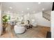 Spacious living room open to the kitchen with hardwood floors, natural light, and modern decor at 803 Courtenay Ne Dr, Atlanta, GA 30306