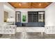 Stylish living area featuring a wood ceiling, custom built-ins, and lots of natural light at 803 Courtenay Ne Dr, Atlanta, GA 30306