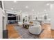 Bright living room with hardwood floors, a modern fireplace, and access to an outdoor screened-in porch at 803 Courtenay Ne Dr, Atlanta, GA 30306
