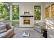 Comfortable screened-in porch with a fireplace and cozy seating offers a relaxing space to enjoy the outdoors at 803 Courtenay Ne Dr, Atlanta, GA 30306