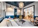 Stylish sitting room featuring a unique ceiling design, neutral walls, and an open view to dining room at 803 Courtenay Ne Dr, Atlanta, GA 30306