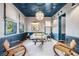 Stylish sitting room featuring a unique ceiling design, neutral walls, and elegant furniture at 803 Courtenay Ne Dr, Atlanta, GA 30306