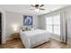 Relaxing bedroom featuring soft lighting, a cozy bed and ample natural light at 113 Regent Pl, Woodstock, GA 30188