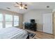 Inviting bedroom featuring natural light from large windows and modern furnishings at 113 Regent Pl, Woodstock, GA 30188
