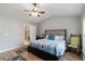 Bright bedroom with ceiling fan, and ensuite bathroom with tiled shower, and warm color palette at 113 Regent Pl, Woodstock, GA 30188