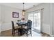 Dining area featuring modern lighting and sliding door access to the outdoor patio at 113 Regent Pl, Woodstock, GA 30188