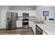 Well-appointed kitchen with granite countertops and stainless steel appliances at 113 Regent Pl, Woodstock, GA 30188