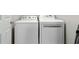 Washer and dryer set in laundry room with white walls and door at 113 Regent Pl, Woodstock, GA 30188