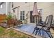 Cozy patio with chairs, table umbrella, and garden at 113 Regent Pl, Woodstock, GA 30188