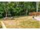 Large, lush backyard with mature trees, a swing set, and plenty of space for recreation and relaxation at 1753 Russell Se St, Atlanta, GA 30316