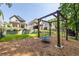 Spacious backyard with a swing set and lush greenery, offering a picturesque outdoor space for recreation and relaxation at 1753 Russell Se St, Atlanta, GA 30316